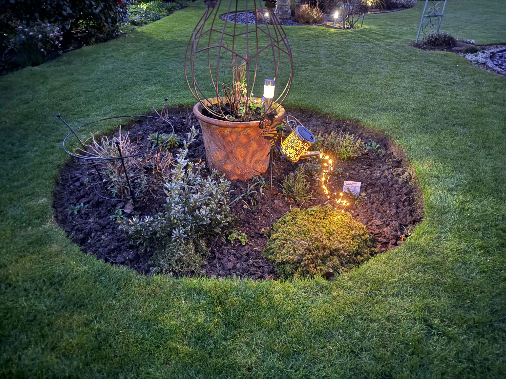Garden lighting detail at dusk.
